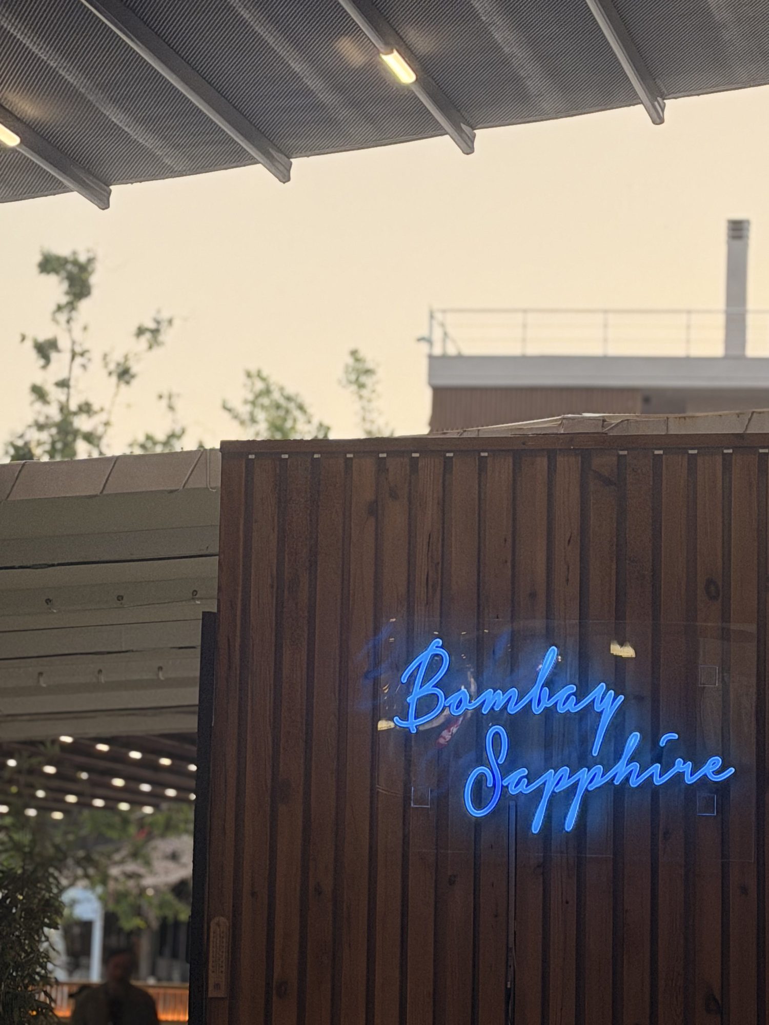 Bombay Sapphire neon sign at dusk